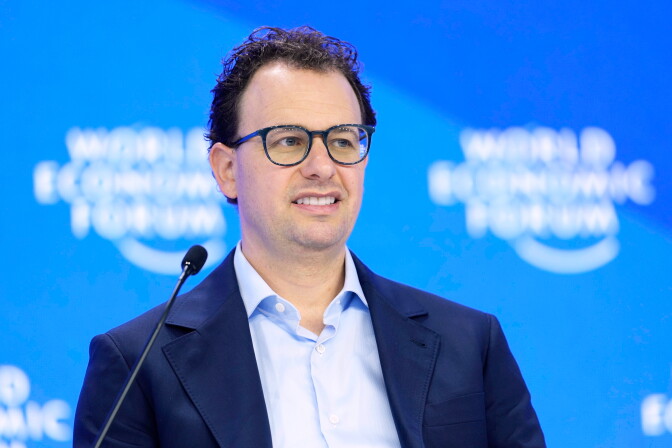 Bust up view of Dario Amodei, CEO and co-founder of Anthropic, at the World Economic Forum in a dark blue suit with a light blue dress shirt.