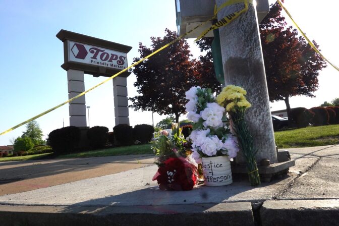 Flowers are left at a makeshift memorial outside of Tops market in Buffalo, New York.