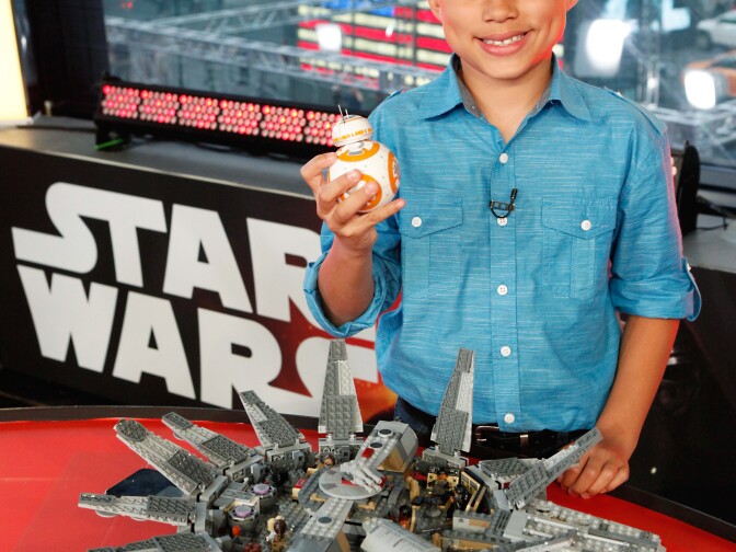 A fan with LEGO Star Wars Millennium Falcon and Star Wars BB-8 from Sphero at a live unboxing event on "Good Morning America" TV show in New York City on Sept. 3, 2015.