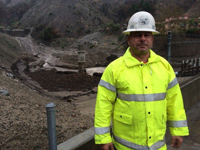 Robert Bodeman, a maintenance worker for the Los Angeles County Department of Public Works, monitors for potentially damaging debris at the Englewild Debris Basin in Glendora. 