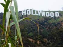 The Hollywood sign is seen during a rain storm in Hollywood, California on January 12, 2017.  
A series of storms that have rolled across California in the past week dumping heavy rain and snow could herald the end of a punishing historic drought, officials said.