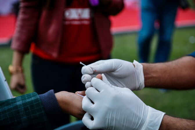 An Indian nurse carries out tests for HIV/AIDS during an event to promote the prevention of sexually transmitted diseases (STDs), and unwanted preganancies, through condom distribution and to create awareness towards safe sex in New Delhi on February 13, 2016. AFP PHOTO / Chandan KHANNA / AFP / Chandan Khanna        (Photo credit should read CHANDAN KHANNA/AFP/Getty Images)