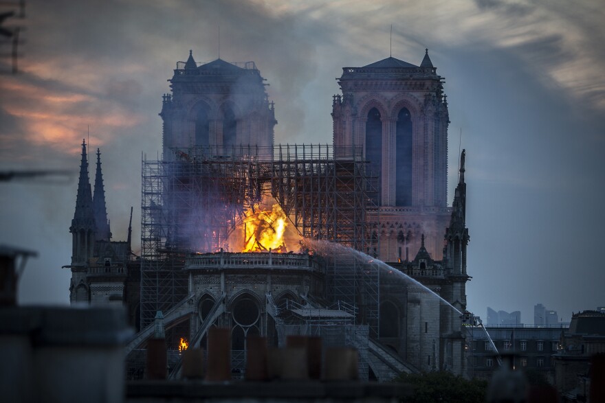 PARIS, FRANCE - APRIL 15: Smoke and flames rise from Notre-Dame Cathedral on April 15, 2019 in Paris, France. A fire broke out on Monday afternoon and quickly spread across the building, collapsing the spire. The cause is yet unknown but officials said it was possibly linked to ongoing renovation work. (Photo by Veronique de Viguerie/Getty Images)