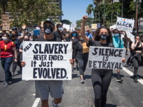  Social workers join Black Lives Matter members during a demonstration against racism and police brutality, outside City Hall in Los Angeles June 13, 2020. 