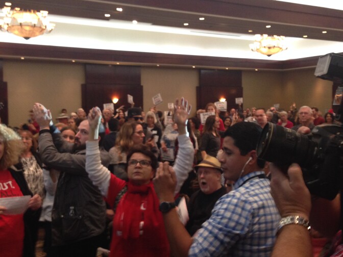 Patricia Larcara, a 28-year resident of Porter Ranch is among audience members at a public meeting who were calling for the permanent closure of Southern California Gas Company's Aliso Canyon natural gas storage field.