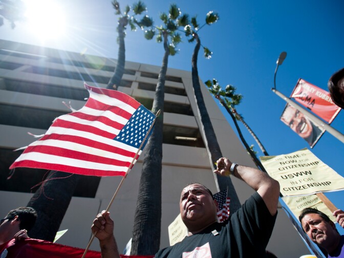 Axel Paredes of CHIRLA walks down Sepulveda Boulevard toward Santa Monica Boulevard. Hundreds of immigration reform supporters took part in a march on Wednesday to Senator Diane Feinstein's LA office. The march coincides with a immigration reform rally in Washington D.C.