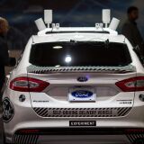 An experimental Ford Fusion self-driving delivery car is displayed at CES in Las Vegas, Nevada, January 12, 2018. / AFP PHOTO / DAVID MCNEW        (Photo credit should read DAVID MCNEW/AFP/Getty Images)