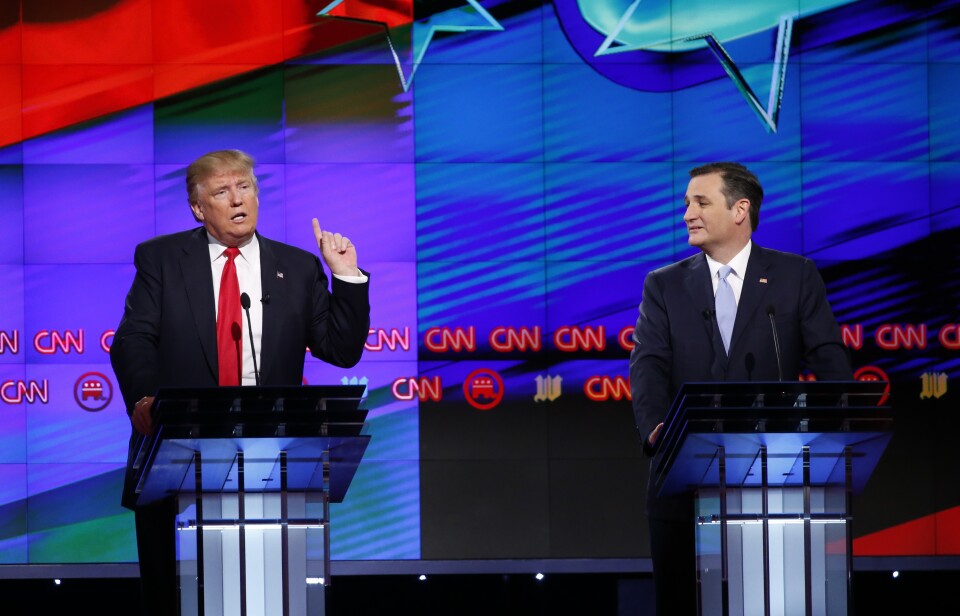 Republican presidential candidate, businessman Donald Trump speaks, as Republican presidential candidate, Sen. Ted Cruz, R-Texas, listens, during the Republican presidential debate sponsored by CNN, Salem Media Group and the Washington Times at the University of Miami,  Thursday, March 10, 2016, in Coral Gables, Fla. (AP Photo/Wilfredo Lee)