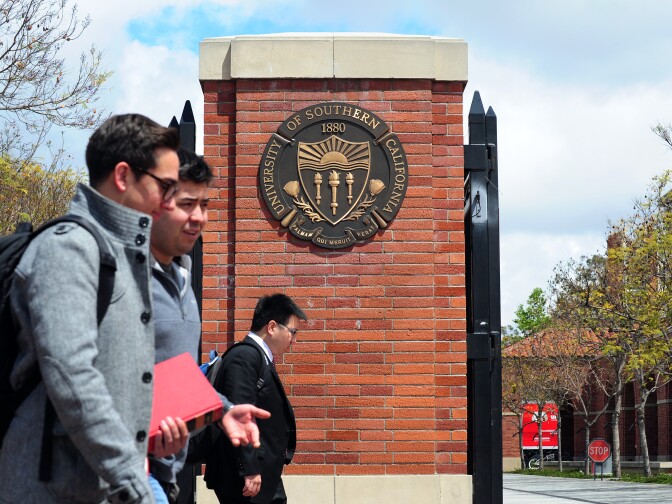 File: Students walk past an entrance to the University of Southern California in Los Angeles on April 11, 2012 in California. 