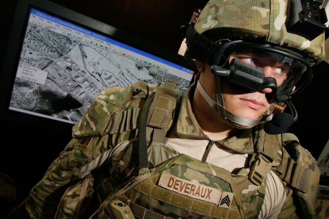 US Army Sgt. Josh Deveraux models the goggle-mounted display (GMD) below his right eye, which can be used to look at the battlefield, part of his Future Force Warrior high-tech combat outfit, during the US Army Soldier Modernization Day expo in the Rayburn House Office Building June 6, 2007 in Washington, DC. The Future Force Warrior integrates GPS, advanced communications, body armor and other computer systems to help coordinate ground troops, aircraft and vehicles in the field. The expo displayed weapons, clothing, body armor and combat rations that are on the cutting edge of military technology.  
