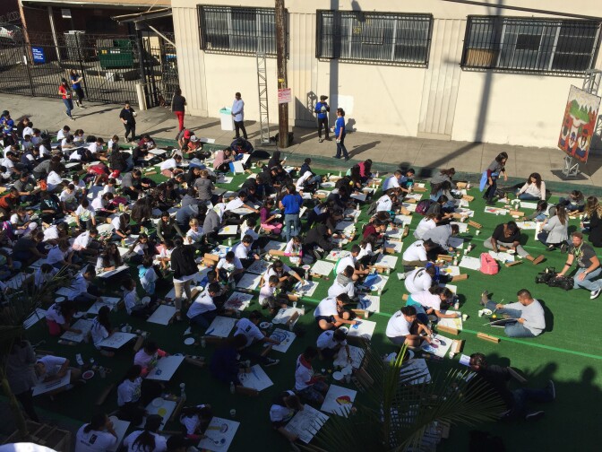 A couple of hundred students from Los Angeles Unified School District schools take a mass class in art from Olga Sinclair, Panama's cultural ambassador.