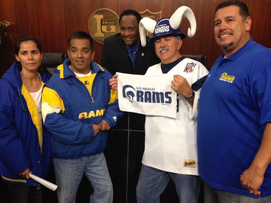 Inglewood's mayor poses with L.A. Rams fans at an Inglewood City Council meeting on Tuesday, Feb. 24, 2015. The mayor was unapologetic about bypassing voters, saying a new stadium was too good an opportunity to wait on.