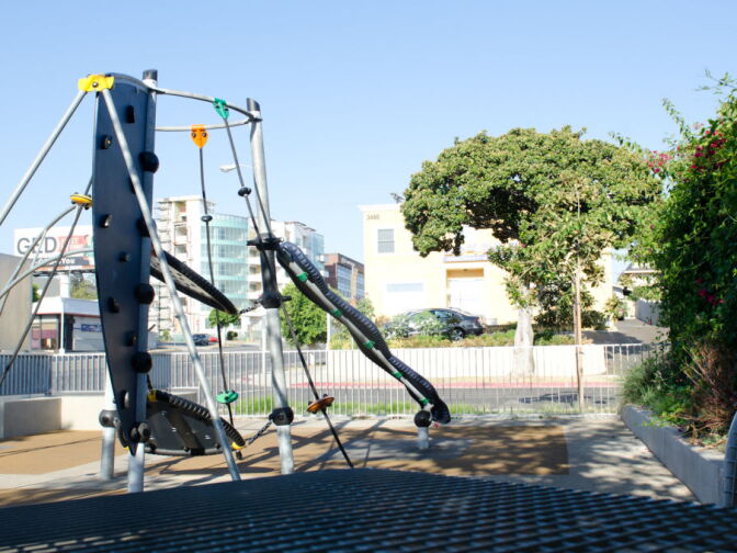 The sustainably designed play structure in the park gives area families a place to play.