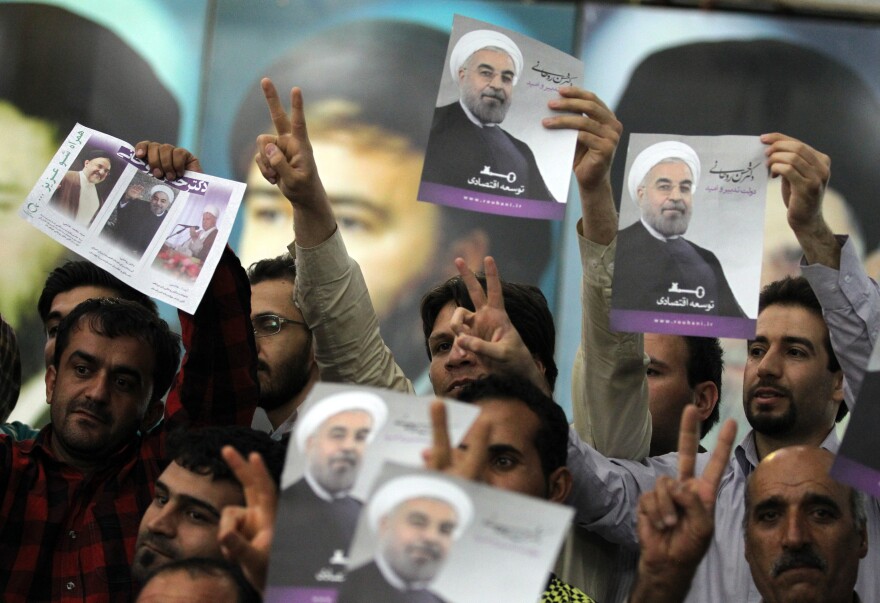 Iranian supporters of President-elect Hassan Rowhani gather at the mausoleum of the founder of Iran's Islamic Republic Ayatollah Ruhollah Khomeini, in Tehran on June 16, 2013, during a visit for Rowhani to the mausoleum. Rowhani hailed his presidential election win as a victory over 'extremism' as jubilant supporters took to the streets, pinning their hopes on an easing of Western sanctions.