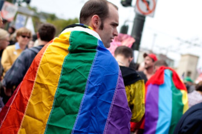 An opponent of Prop 8 holds a gay pride flag outside of San Francisco city hall to celebrate the ruling to overturn Prop 8 August 4, 2010 in San Francisco, California.