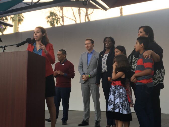 Newly-elected Los Angeles Unified School Board member Kelly Gonez speaks at a rally in downtown L.A. Behind her, from left: fellow board members Ref Rodriguez and Nick Melvoin, district superintendent Michelle King and board member Mónica García. 