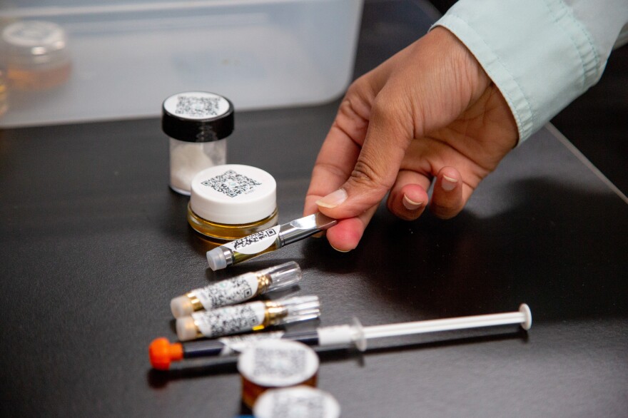 Chief Scientific Officer Swetha Kaul examines various forms of tested marijuana products inside the Cannalysis Laboratory in Santa Ana, California, June 20, 2018. Starting July 1, all marijuana sold in California needs to be tested in a licensed lab.
