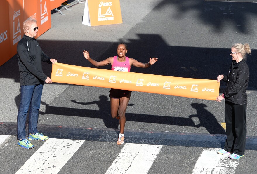 Amane Gobena of Ethiopia reacts as she crosses the finish line to win  the women's elite class of the Los Angeles Marathon on March 9, 2014 in Santa Monica, California.