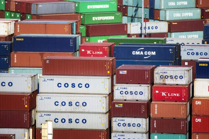 Cargo ships are loaded at the Ports of Los Angeles and Long Beach on Friday, Feb. 19, 2016.