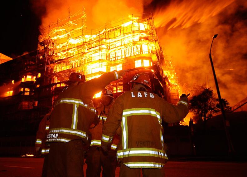 Firefighters in front of the massive Da Vinci building fire on Dec. 8, 2014.