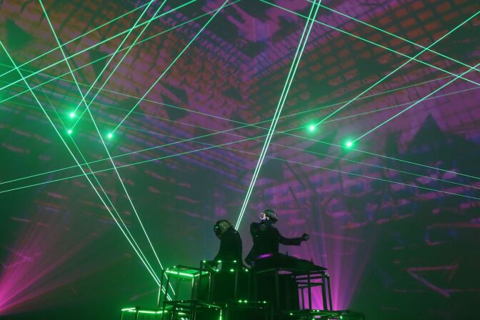 lasers and light show with two days in helmets in the middle of the floor.