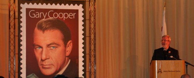 Leonard Maltin welcomes visitors to the U.S. Postal Service’s Gary Cooper Commemorative Stamp unveiling at the Autry National Center in Los Angeles.