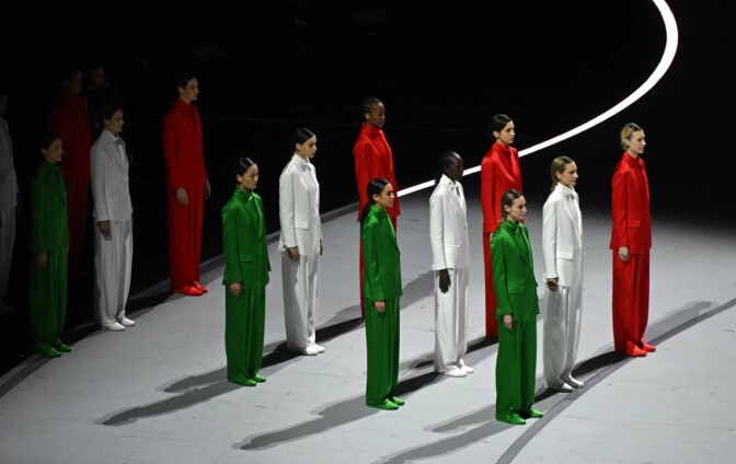  Performers dressed in the colors of the Italian flag line up during the opening ceremony.