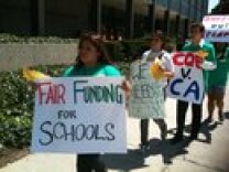 Students rally in Long Beach in support of a lawsuit to improve funding for public schools.