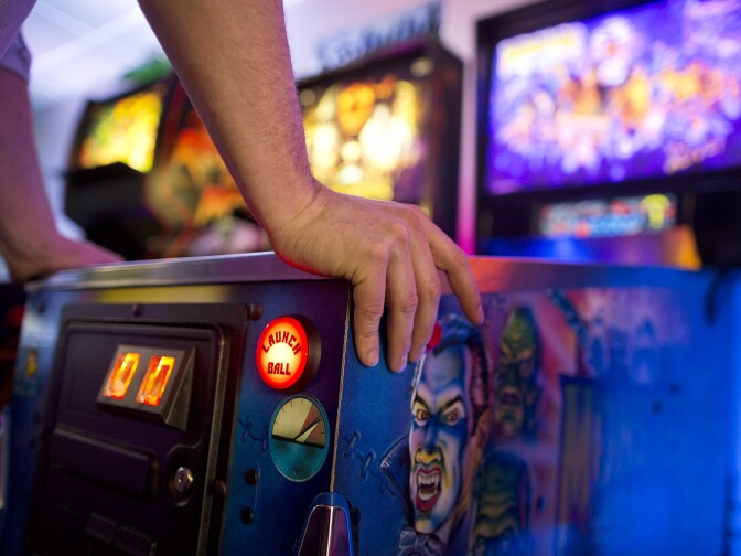 Will Stifel plays Monster Bash Pinball during his lunch break at Neon Retro Arcade in Pasadena on Wednesday afternoon, Feb. 4.
