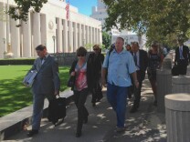 Defendants in a case against Los Angeles Sheriff's Department employees, their attorneys and their supporters leaving court on Tuesday, July 1, 2014.