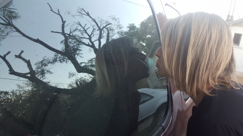 Kissing her wheels goodbye. Sue Carpenter prepares for life without a car for the month of October 