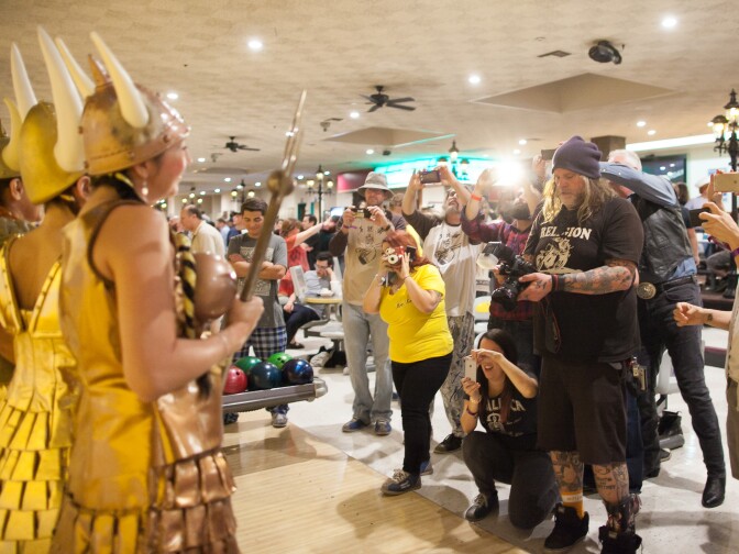 Lebowski Fest attendees dressed as Viking Maude pose for photos at Fountain Bowl in Fountain Valley, Calif. on Saturday, Mar. 14, 2015.
