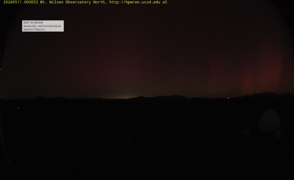 Northern lights emerging in the dark