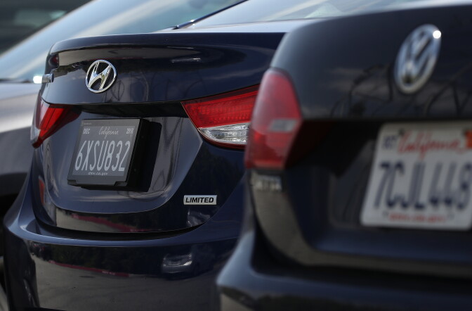 FOSTER CITY, CA - MAY 30:  A digital license plate (L) made by Bay Area company Reviver Auto, part of a pilot project with the state Department of Motor Vehicles, is displayed on a car at Reviver Auto headquarters on May 30, 2018 in Foster City, California. California is the first state in the U.S. to test digital license plates on vehicles. According to the California State Department of Motor Vehicles, there are currently 116 cars in California that are part of a pilot program testing the new plates that will eventually be sold at auto dealerships for $699 plus installation costs. Digital plates are expected to roll out in Florida, Arizona, and Texas later this year.  (Photo by Justin Sullivan/Getty Images)