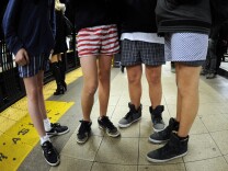 Some riders in the New York City subway in the underwear as the take part in the  2012 No Pants Subway Ride  January 8, 2012. Started by Improv Everywhere, the goal is for riders to get on the subway train dressed in normal winter clothes (without pants) and keep a straight face.    AFP PHOTO / TIMOTHY  A. CLARY (Photo credit should read TIMOTHY A. CLARY/AFP/Getty Images)