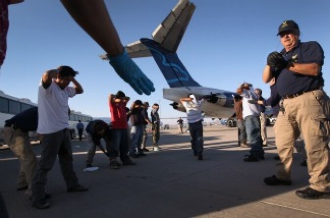 Undocumented Guatemalan immigrants are body searched before boarding a deportation flight to Guatemala City, Guatemala at Phoenix-Mesa Gateway Airport on June 24, 2011 in Mesa, Arizona.
