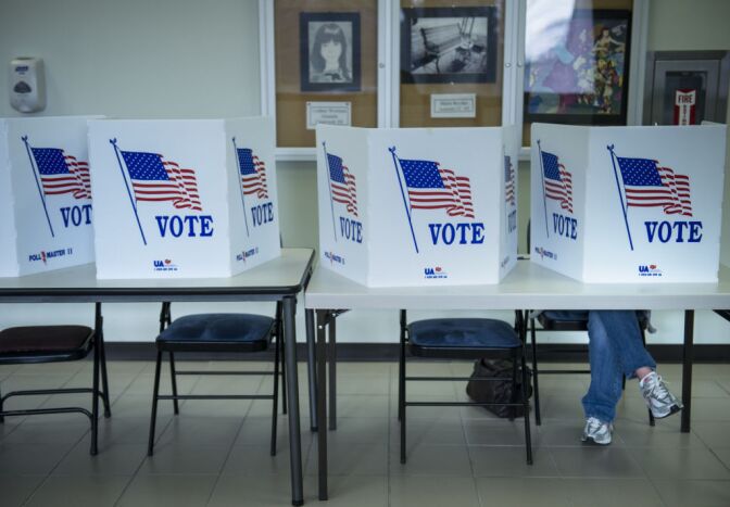 A citizen votes on a paper ballot during the final day of early voting at the Lancaster Board of Elections November 5, 2012 in Lancaster, Ohio. Ohio, a battleground state which no Republican has won the US Presidency without its electoral votes, is closely contested between US President Barack Obama and Mitt Romney. 