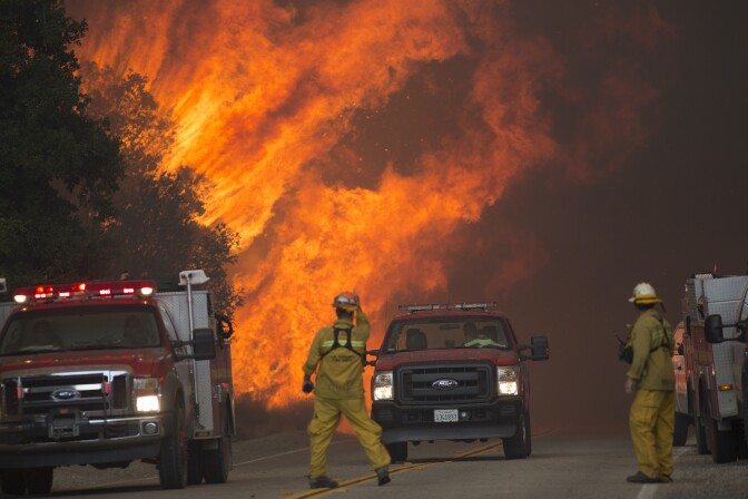 File: Firefighters are forced to retreat as flame close in on them in Placerita Canyon at the Sand Fire on July 24, 2016 in Santa Clarita.