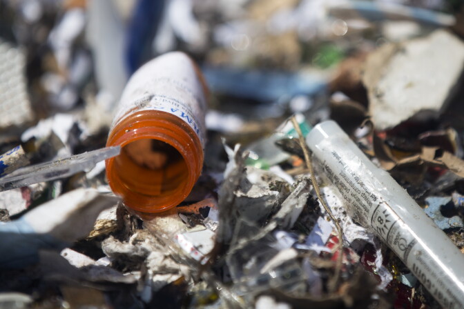 A prescription drug bottle sits inside a bin of recyclables at the Burbank Recycling Center on Friday, March 18, 2016. Los Angeles County will consider an ordinance that would make drug and sharp manufacturers develop a program to collect and manage pharmaceutical waste from residents.