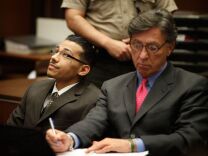 Pedro Espinoza (L) reacts after the jury announced their verdict on May 9, 2012 in Los Angeles, California. Espinoza was found guilty of first-degree murder for the fatal shooting of high-school football player Jamiel Shaw Jr., in 2008, before a death sentence was recommended by a jury in the penalty phase.
