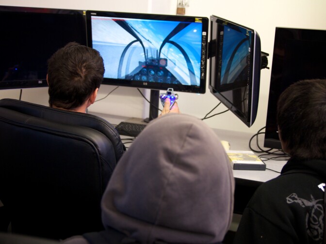 Kids touring the Tomorrow's Aeronautical Museum get to practice on a flight simulator.