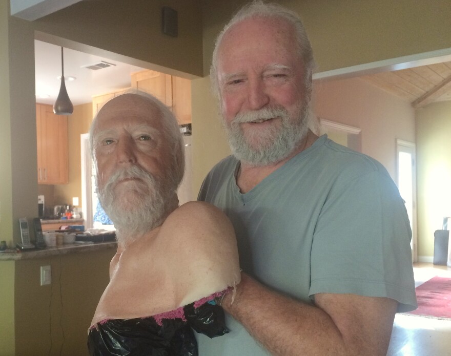 Actor Scott Wilson, whose character, Hershel Greene, had his head severed in the TV series The Walking Dead, with a replica used in the scene.