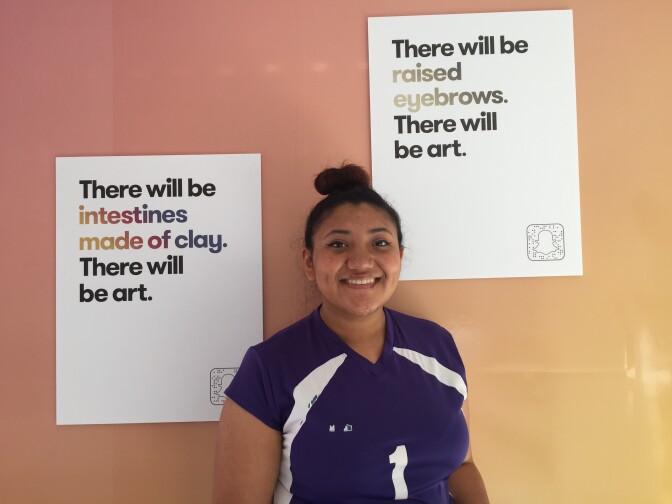 Manual Arts senior Kimberly Gonzalez, who said she loves to draw, tried creative writing while at the kickoff event. 