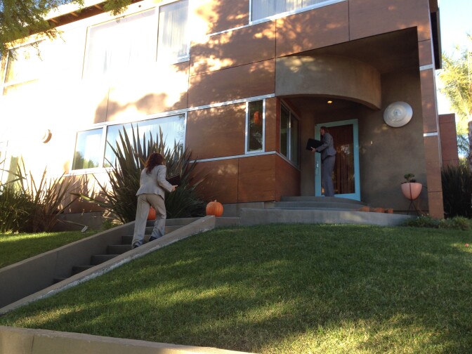 Officers canvassed the neighborhood for potential witnesses near the Silver Lake home of Assemblyman Mike Gatto's father, who was found dead late Wednesday.