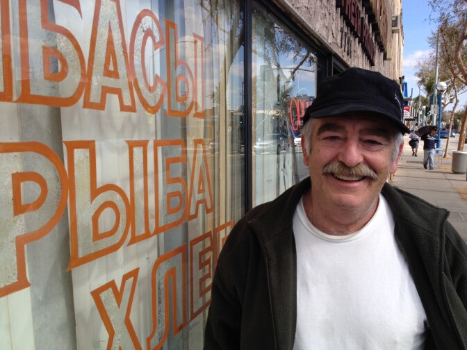 Edward Kessler stands outside Odessa Market in West Hollywood, which is frequented by many Russian speakers. Most said they are closely following the Sochi Winter Olympics in Russia.