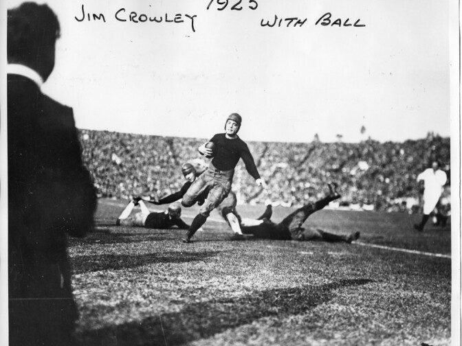 It is difficult to imagine that the player charging through the defensive line in this photograph was nicknamed "Sleepy Jim" by his coach, Knute Rockne. Jim Crowley was one of Notre Dame's legendary "Four Horsemen," who won the Rose Bowl game against Stanford in 1925. Crucial to the win, Crowley almost did not play in the game because he and teammate Ed Huntsinger were caught staying out late the night before.