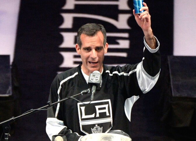LOS ANGELES, CA - JUNE 16:  Los Angeles Kings Mayor Eric Garcetti raises a beer and swears during the Los Angeles Kings Victory Parade And Rally on June 16, 2014 in Los Angeles, California.  (Photo by Harry How/Getty Images)