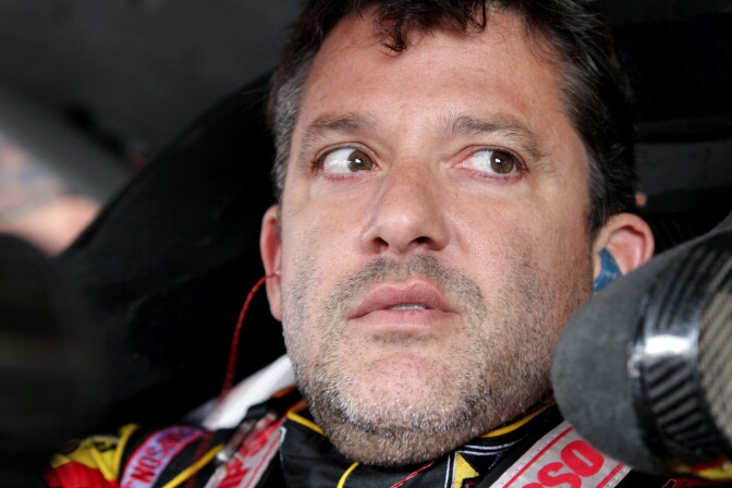 WATKINS GLEN, NY - AUGUST 08:  Tony Stewart, driver of the #14 Rush Truck Centers/Mobil 1 Chevrolet, sits in his car during practice for the NASCAR Sprint Cup Series Cheez-It 355 at Watkins Glen International on August 8, 2014 in Watkins Glen, New York.  (Photo by Jerry Markland/Getty Images)