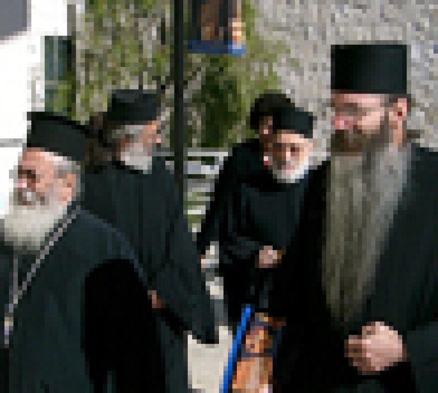 Monks of St. Catherine's at the Getty. Leading the way, His Eminence Archbishop Damianos (L) and Father Justin, holding a bag of basil, used in a blessing of the exhibit.