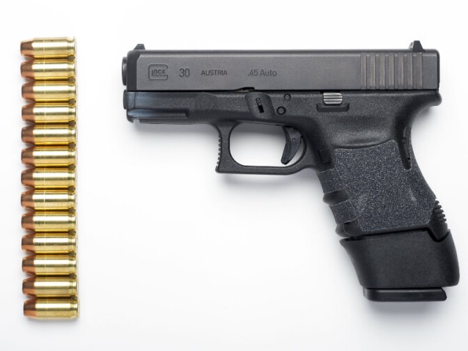 A Glock 30SF .45 Auto semi-automatic pistol with a Glock 13-round extension magazine installed, and 13 rounds of hollow-point ammunition are seen in Alexandria, Va., Wednesday, Feb. 10, 2016. 